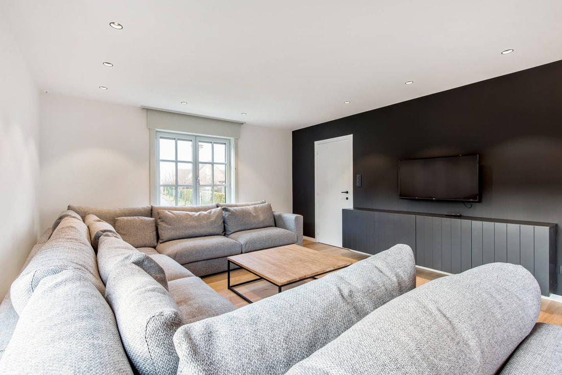 Bright lounge with large corner sofa